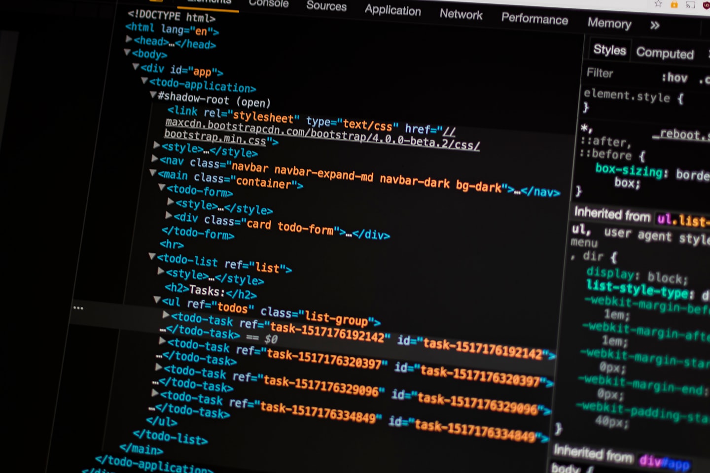 Computer screen showing web development code in developer tools.